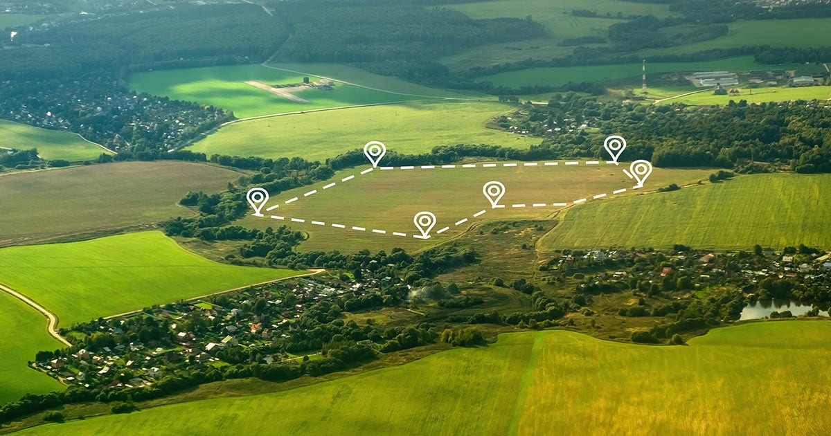 Aerial view of green field, position point and boundary line to show location and area Aerial view of green field, position point and boundary line to show location and area