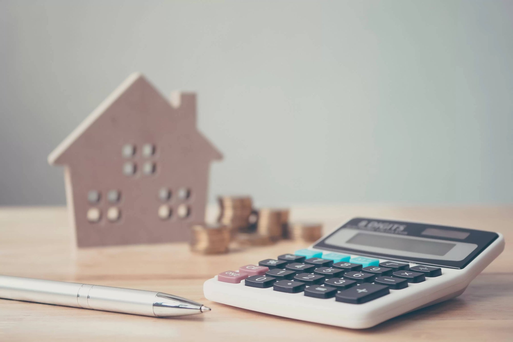 model home and calculator on table