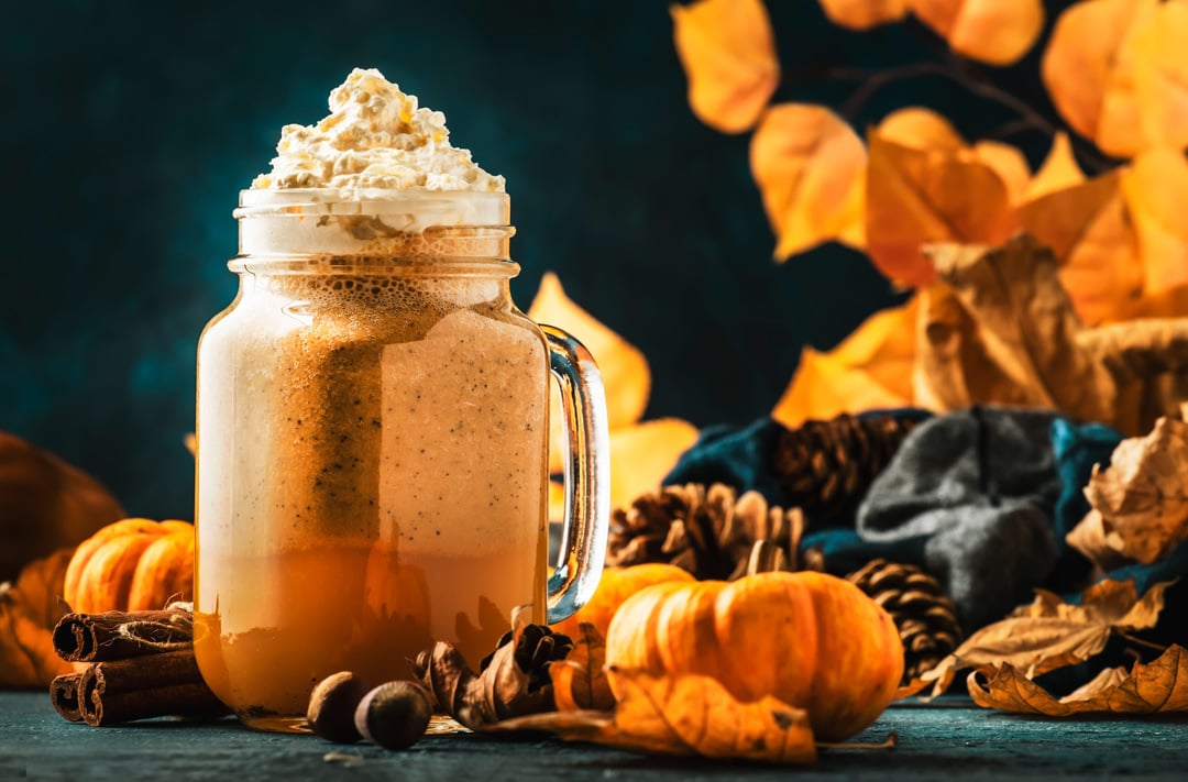 pumpkin-spiced-latte-or-coffee-in-glass-jar-on-blu-2023-11-27-04-49-55-utc-WEB