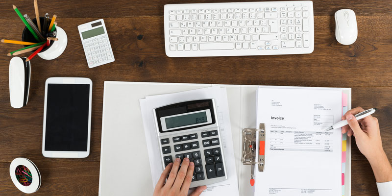 Overhead of calculator with documents and keyboard