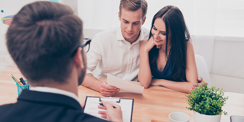 couple talking with loan officer agent