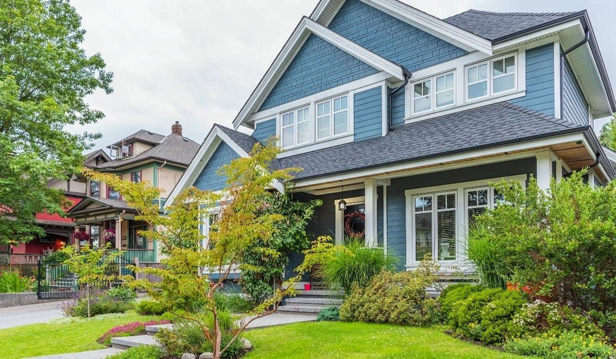 blue craftsman house in suburbs