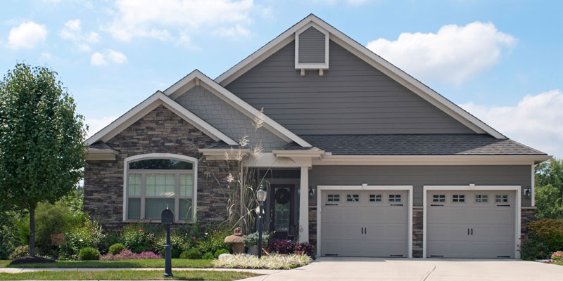 Front of house with double garage and driveway