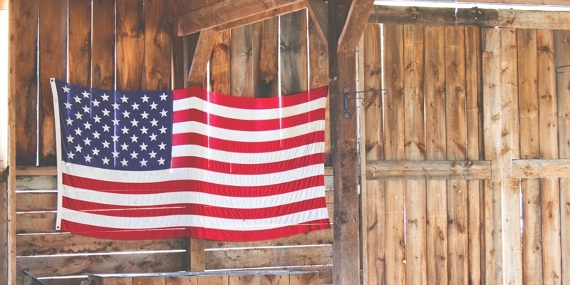 American Flag against Hardwood Barn