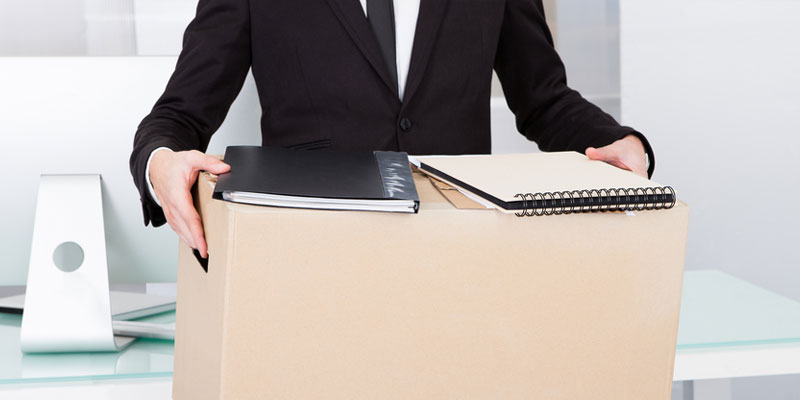  Business man with box and books to move